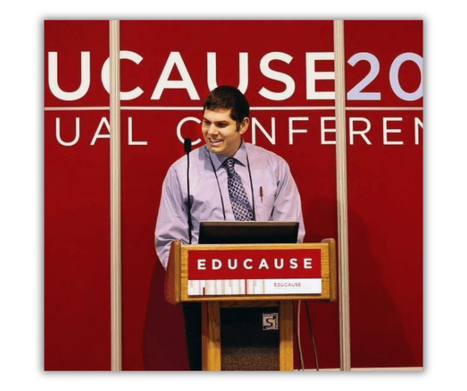 Judd Rattner speaking at a podium for an Educause event