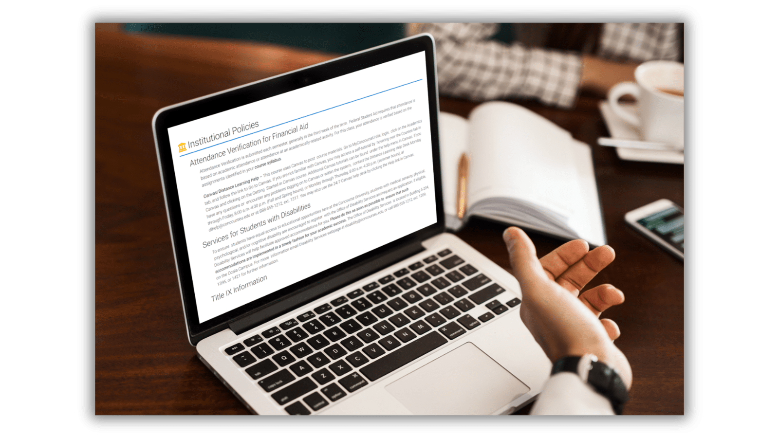 Laptop previewing institutional policies on a syllabus